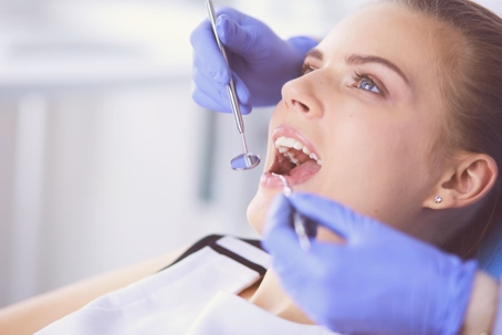 dentist treating on a woman patient