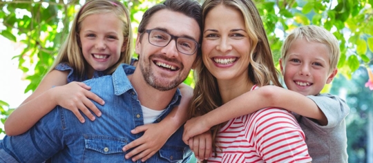 family of 4 smiling